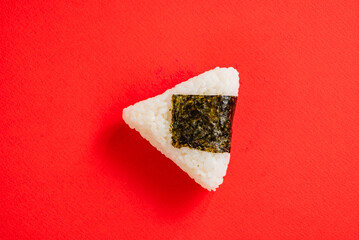 Triangular onigiri on the color background