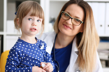 Little child with mother at pediatrician reception. Physical exam cute infant portrait baby aid healthy lifestyle ward round child sickness clinic test high quality and trust concept