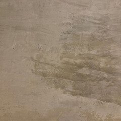 The gray cement background wall has a pattern made of cement plaster.