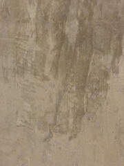 The gray cement background wall has a pattern made of cement plaster.