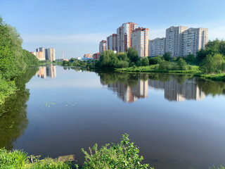Moscow region, the city of Balashikha. Pekhorka river in summer morning and  view of Zarechnaya street