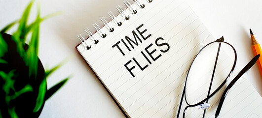 Keyword TIME FILES - seo business concept text on a white notebook and glasses, pencil , green...