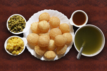 A popular Indian snack called pani puri. Pani puri is a popular food item in India it is also known as puchka or gol gappe.  - obrazy, fototapety, plakaty