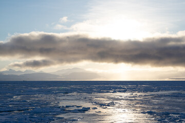 Frozen fjord covered by sea ice in the Arctic on Spitsbergen