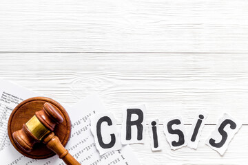 Financial crisis concept with gavel - debt, bankruptcy - on white wooden background top view copy...
