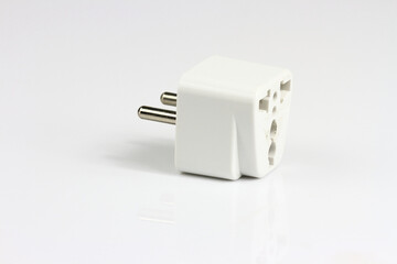 old electric adaptors white plastic on white background