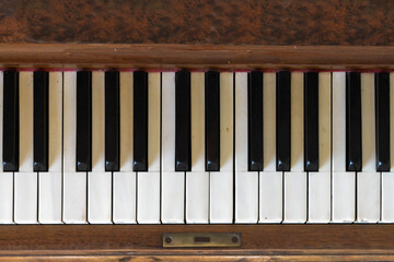 Tickle the ivories of an old piano.