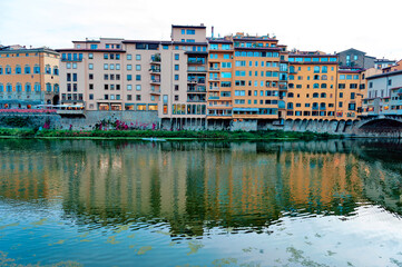 Scenic view of the Arno river, the main waterway of Tuscany region running through the medieval city of Florence in Italy