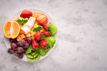 Bowl with a assorted of fruits for fruit salad with copy space