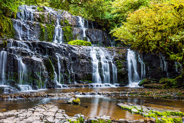 Fototapeta na wymiar The waterfalls among the forest