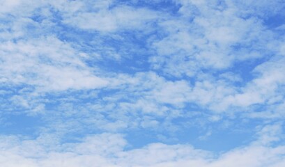 Fluffy white clouds on background of blue sky wallpaper