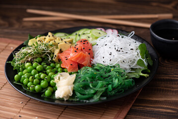 rice noodles with seaweed, vegetables, herbs and sesame seeds