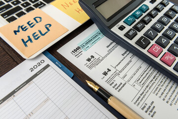 Naklejka na ściany i meble Tax concept sticker need help with calculator on federal tax form