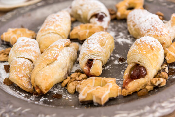 Tasty baked and sprinkled with powdered sugar bagel and bun