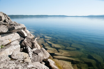 Landscape view of Turgoyak lake with its rocky shore, South Ural, Russian Federation