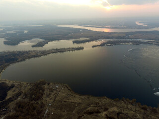 Aerial view of the countryside (drone image).Near river Desna.Winter time.Sunset. Kiev,Ukraine