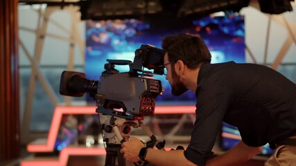 Cameraman Working In TV Studio Video Production Filming Interview.Television Operator On TV Broadcasting Production Channel. Camera Operator On News Room Shoot Media Movie.Making TV Show Or Film.