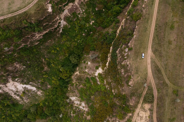 Aerial top view of rocks and tree, mountain ecosystem and healthy environment concept and background, Texture of green tree, stones and land