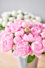 Pink Angel Cheeks peonies in a metal vase. Beautiful peony flower for catalog or online store. Floral shop concept . Beautiful fresh cut bouquet. Flowers delivery