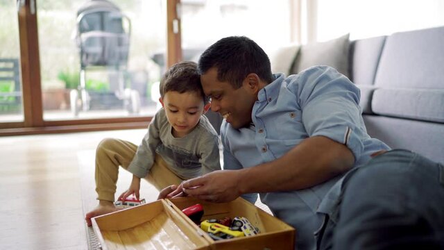 MS Father and son (2-3) playing with car toys / Denmark