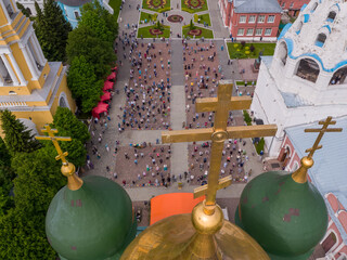 KOLOMNA, MOSCOW REGION, RUSSIA - JUNE 7, 2020: An aerial view of believers observing social distancing in front of the Assumption Cathedral during a religious service.