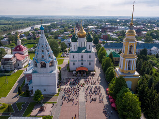 KOLOMNA, MOSCOW REGION, RUSSIA - JUNE 7, 2020: An aerial view of believers observing social distancing in front of the Assumption Cathedral during a religious service.