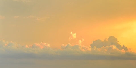 Beautiful puffy clouds at sunset. 