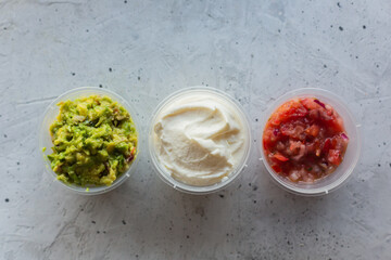 Traditional mexican sauces on the gray concrete background