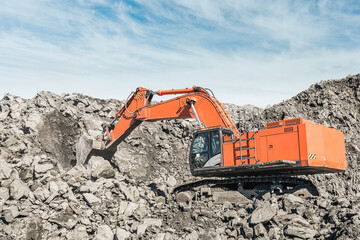 Large quarry dump truck. Loading the rock in dumper. Loading coal into body truck. Production...