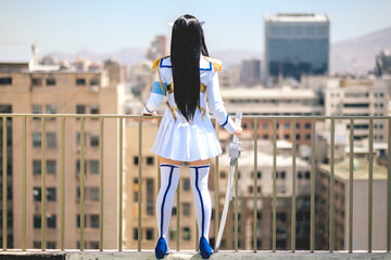 Girl with craft made cosplay of anime from behind in the rooftop of a building in Santiago downtown