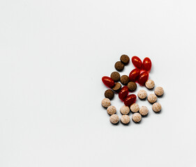 pills of different colors and composition