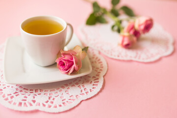 Cup of tea on soft pink background