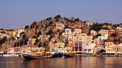 Symi town, Symi island, pictorial view of colorful houses and the harbour