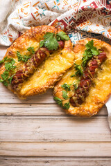 Hot pizza with sausage and cheese on wooden table. Food concept