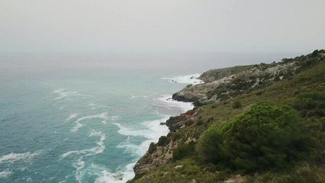 AERIAL WS Coastline and sea on cloudy day / Elba island, Tuscany, Italy