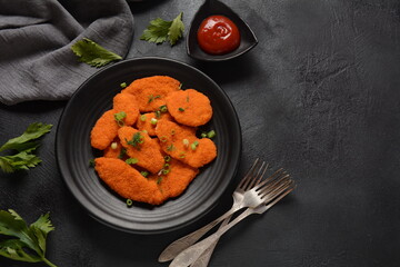 Chicken nuggets or schnitzel and sauce, fast food