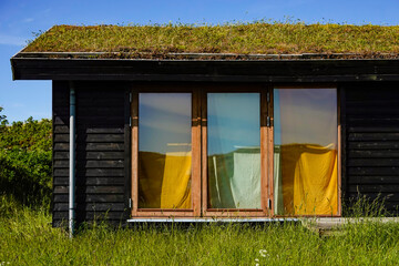 Hirtshals, Denmark A small grass roofed house in the grassy country house.