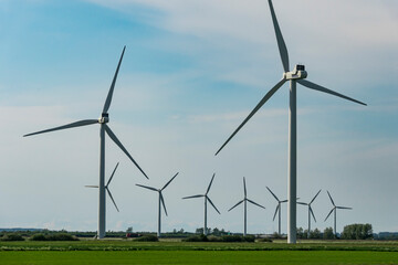 Aalborg, Denmark  A windmill park on a field.