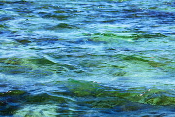 Fototapeta na wymiar Glittering blue sea water in the famous Mediterranean summer destination 