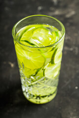 Colorful cocktail with thin lime slices. Selective focus. Shallow depth of field. 