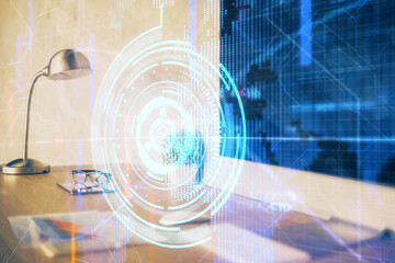 Double exposure of desktop computer and technology theme hologram. Concept of software development.