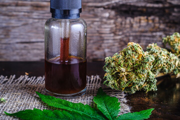 brown medical cannabis resin extract in bottle of medicine dropper.