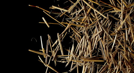 Straw, thatch, hay pile isolated on black background and texture, top view