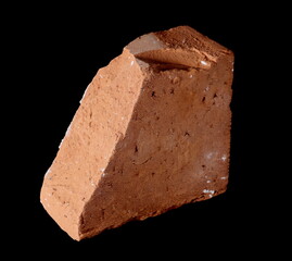 Broken brick for bricklaying and construction isolated on black background