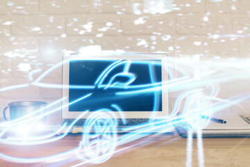 Desktop computer background in office with automobile hologram drawing. Multi exposure. Tech...