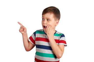 Shocked little boy pointing with his finger on something, isolated on white background