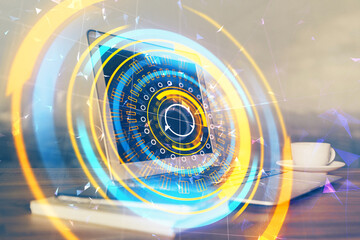 Fototapeta premium Computer on desktop in office with technology theme hologram. Multi exposure. Tech concept.