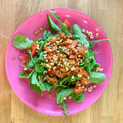 Salad of arugula, tuna, tomato, eggs and pine nuts
