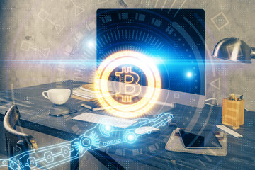 Double exposure of blockchain and crypto economy theme hologram and table with computer background....