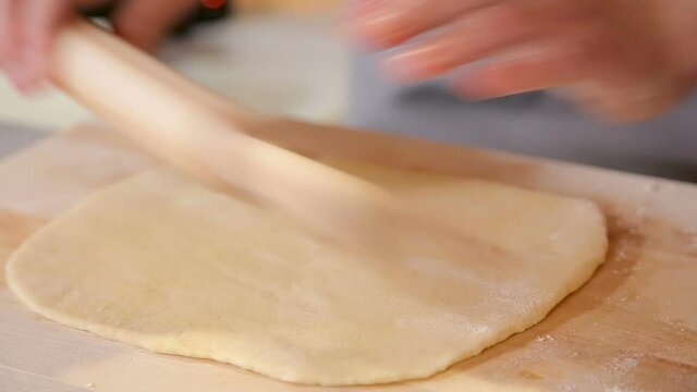 Rolling thin dough for pizza